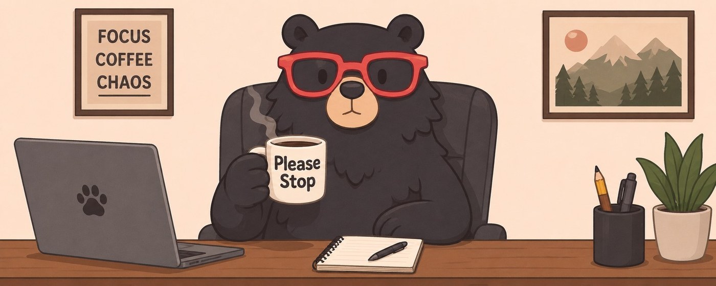 Oscar the bear at his desk with coffee, surrounded by a Focus Coffee Chaos poster